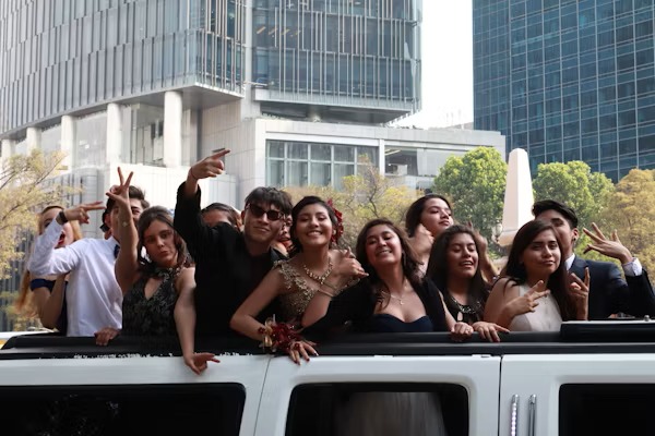 Happy customers enjoying luxury limousine service from www.transportmovementhub.pro during a memorable event.
